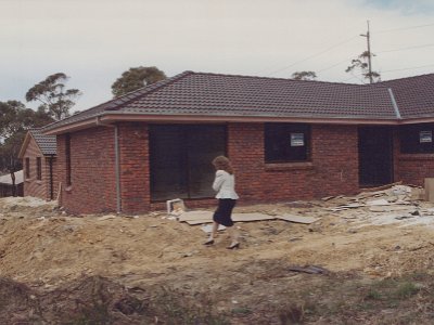 Jenni heads towards the master bedroom.