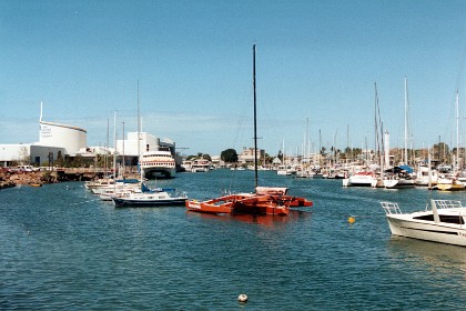 Imax theatre and boats on Ross Creek. The ferry goes to Magnetic Island.