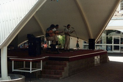 I then catch another plane and go to Cairns. A band plays in one of the streets.