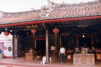 You could wander around here (without removing shoes) inside the temple, take pictures and talk, while people are praying. To me,  It seems disrespectful of another person's religion and invasion of their privacy