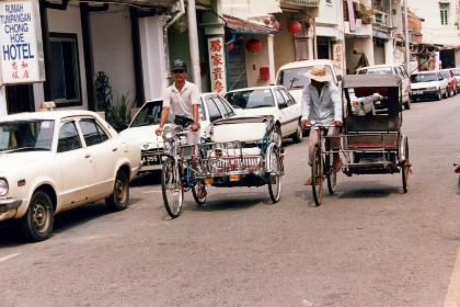 More rickshaws; you don't see these in the modern city of Kuala Lumpur.