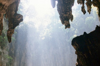 The cave exits back to the open air through a huge hole. It is very spectacular with the sunlight shining through.