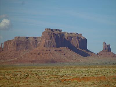 Card 2 099 Monday 2004-03-22 Monument Valley The floor is largely Cutler Red siltstone or its sand deposited by the rivers that carved the valley. The valley's vivid red...