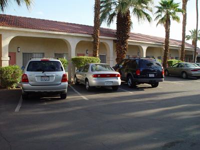 Card 1 015 Friday 2004-03-12 Blythe, California We stop overnight in Blythe on the CA/AZ border. That's our Alamo Chevvy Cavalier in the centre; very bland, very ordinary....