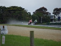 Casey STONER powers past Tony ELIAS Spain, Honda.