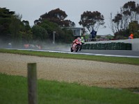 Casey STONER powers past Tony ELIAS Spain, Honda.