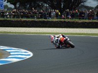 MotoGP warm-up Nicky HAYDEN, Honda. Look at the difference in riding styles and lean angles.