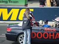 Our girl interviewing Mick Doohan, probably asking if he's excited or who he thinks is going to win.