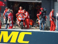 MotoGP Pit Lane Casey's bike being wheeled out ready for action.