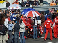 MotoGP race Casey's wife Adriana is his umbrella person.