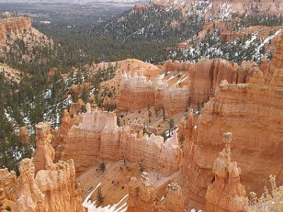 Geologically, the cliffs are pink and red-coloured Claron Formation limestones, forming the upper riser of the Grand Staircase that descends southward from here to the Grand Canyon in Arizona.  The balancing rock in the right foreground is called Thor's Hammer.