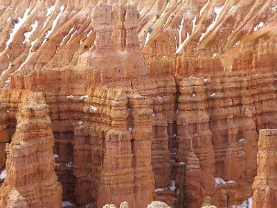 Hoodoos are composed of soft sedimentary rock and are topped by a piece of harder, less easily eroded stone that protects the column from the elements.