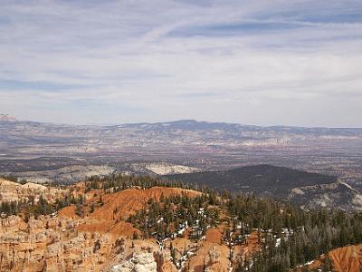 The brochure says that you can see Navajo Mountain 130 kms away from Rainbow Point. I think that's Navajo Mountain faintly visible in the far distance in about 1/3 from the left centre. It's a 5hr 40min roundabout drive to get there.