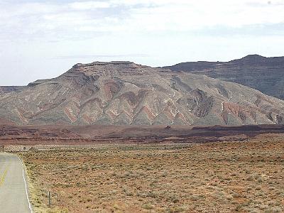 Saturday  2007-03-10  US163, Utah  We then head east along US 163 to the little town of Bluff, Utah.  Just before Bluff are these fascinating wavy rock formations.  The waves were made when pressure on both sides of fault lines pushed against each other.