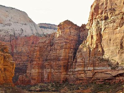 The Navajo sandstone, the white stuff at the top, dates from the Jurassic period about 200 - 145 MYA. The stuff underneath, the Kayenta formation,  is (duh) older and also from the Jurassic.  All of the rocks are sedimentary, sometimes from sand or mud at the bottom of the sea and other times from desert sands.