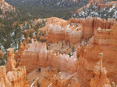 The name given to the rock layer that forms hoodoos at Bryce Canyon is the Claron Formation. This layer has several rock types including siltstones and mudstones but is predominantly limestone. These cliffs form the upper riser of the Grand staircase that descends southward from here to the Grand Canyon in Arizona.  The balancing rock in the right foreground is called Thor's Hammer.