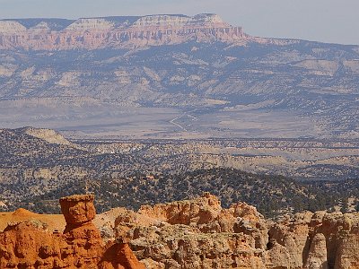 In front of us is the  Grand Staircase-Escalante National Monument . There are three main regions: the  Grand Staircase , the  Kaiparowits Plateau  (in the distance), and the  Canyons of the Escalante  (the scar running L to R across the centre).  President Bill Clinton designated the area as a national monument in 1996 using his authority under the Antiquities Act.