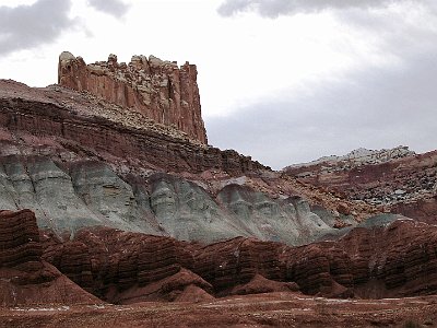 The top layer is Navajo Sandstone. Next is the red Kayenta formation, then Wingate Sandstone.  The greyish layer is called the Chinle formation laid down during the Triassic, a time when all of the continents were joined together. It sits on top of the Moenkopi formation, a layer in which dinosaur remains have been found.