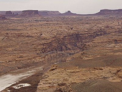 There are no paved roads through the magnificent scenery in the distance to the east; 4X4 only. It is part of the SE region of Canyonlands National Park. We cross the bridge from left to right and continue travelling in a generally southerly direction.