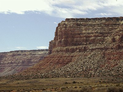 It is a couple of thousand feet to the valley floor - to the Valley of the Gods. A dirt road takes you into the valley itself which has similar geologic structures to Monument Valley.