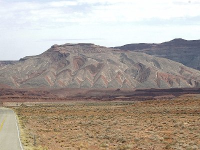 We then head east along US 163 to the little town of Bluff, Utah.  Just before Bluff are these fascinating wavy rock formations.  The waves were made when pressure on both sides of fault lines pushed against each other.