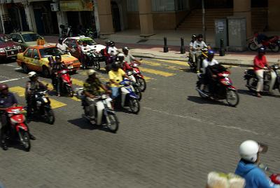 FRIDAY 17 OCTOBER 2008  One feature of Malaysian traffic is the huge number of small motorcycles. The risks some of them take are plain stupid: for example, lifting the helmet up, talking on a mobile phone hand while steering one-handed between our bus and moving cars.