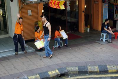 FRIDAY 17 OCTOBER 2008   Along Jalan Bukit Bintang are places offering foot massages - reflexology. When you walk past, they don't understand no and are complete pests.  The guy on the left waves to me as I take the picture.