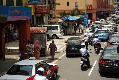 FRIDAY 17 OCTOBER 2008   A policeman gives a driver a ticket while he ignores a stream of Police weaving in and out of the traffic.  The rider at the very front of the queue was not stopped or booked.