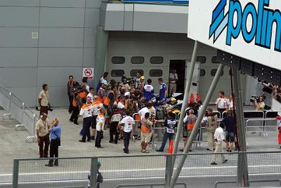 SATURDAY 18 OCTOBER 2008  After the checkered flag, it appeared that Rossi had taken pole. But Pedrosa was still out there and pipped Rossi in the dying seconds.  Here,  wearing the yellow cap of one of his sponsors, Rossi talks with the media.