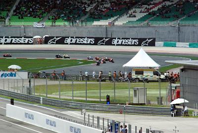 SUNDAY 19 OCTOBER 2008 - RACE DAY  The bottom stands are starting to fill. Marco is second coming out of turn 1.