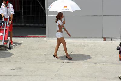 SUNDAY 19 OCTOBER 2008 - RACE DAY   An attractive kiddie walks to the starting line to shade one of the San Carlo Honda MotoGP riders.