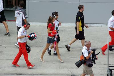 SUNDAY 19 OCTOBER 2008 - RACE DAY  Casey's wife Adriana walks to the starting grid. She's amazingly lean and fit and she probably works out with Casey.