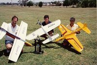 1994 Encore 6  At a contest in Tamworth with Herb Hanna and Reg Towell. The plane flies so well that I regret not putting a decent finish on it.  So I sand it back and leave it on the painting jig ready for paint. Then the cat jumps on it and completely destroys the plane as she struggles for grip. The cat lived.