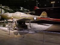 In December 1941 the BELL P-39Q AIRACOBRA was one of America's first-line pursuit planes.  Its unique engine location behind the cockpit caused some pilot concern at first, but experience showed that this was no more of a hazard in a crash landing than with an engine located forward of the cockpit. The P-39's spin characteristics, however, could be a problem if proper recovery techniques were ignored. : 2009-11-04 USA Air Force Museum