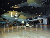 After World War II, many C-47s remained in U.S. Air Force service, participating in the Berlin Airlift and other peacetime activities. The C-47D on display, the last C-47 in routine USAF use, flew to the museum in 1975. A WACO CG-4A HADRIAN glider hangs from the ceiling; C-47s often towed these into combat zones. : 2009-11-04 USA Air Force Museum