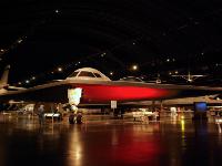 The NORTHROP B-2 SPIRIT  merged the high aerodynamic efficiency of the "flying wing" design with composite materials, special coatings and classified stealth technologies to become virtually invisible to air defense radar systems. Its speed is high subsonic. Northrop Grumman constructed two additional aircraft without engines or instruments for fatigue testing, the second of which is the aircraft on display. : 2009-11-04 USA Air Force Museum