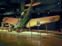 This display is called "A flight training mishap" that demonstrates what could happen to a cadet pilot when taxiing with the wind from behind and applying his brakes too hard. The wind would lift the tail, and the nose would hit the ground. : 2009-11-04 USA Air Force Museum