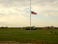 It's now Friday 6 November and, after my second full day at the museum, I walk to my motel which can be seen in the distance.  The flag is at half mast because  a US Army Officer stationed at Fort Bragg in Texas went berserk and killed 13 people. : 2009-11-04 USA Air Force Museum