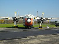 The C-119J on display was specially modified for the mid-air retrieval of space capsules re-entering the atmosphere from orbit. On August 19, 1960, this aircraft made the world's first mid-air recovery of a capsule returning from orbit when it "snagged" the parachute lowering the Discoverer XIV satellite at 8,000 feet altitude, 360 miles southwest of Honolulu. A winch operator then hauled it on board. : 2009-11-04 USA Air Force Museum