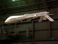 The GENERAL ATOMICS RQ-1 PREDATOR is an Umanned Aerial Vehicle (UAV) and it operates as part of a system: four UAVs, a ground control station, a satellite communications terminal and 55 personnel. It was powered by a four-cylinder 81-hp engine and  could cruise at 87 miles per hour for 16 hours. : 2009-11-04 USA Air Force Museum