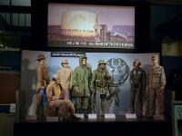 At the end of the gift shop, about halfway down the hangar, you are greeted with this tribute to the service men and women of the US Armed services.  The Great Seal of the USA is visible. It has a bald eagle clutching 13 arrows in its left claw and an olive branch in its right. : 2009-11-04 USA Air Force Museum