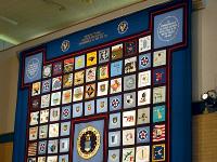 The four corners of the quilt are dedicated to installations that have closed in the US and worldwide.  The top border is embroidered with the Air Force core values and is flanked by the 50th anniversary logo of stars and wings.  Thread used to join the squares together was flown aboard the Space Shuttle Atlantis on its Sept. 22 1997, mission.