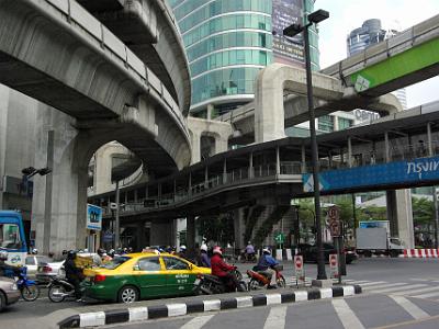 Twin overhead merging double-decker rail lines in Bangkok.