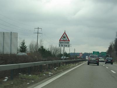 Thursday 2009-03-26&nbsp;&nbsp;&nbsp;   On the A4 heading east    Those white puffs at the side of the road are snow. Spurrinnen means ruts.