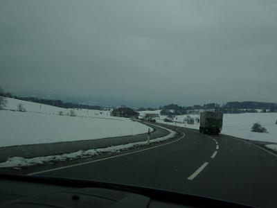 Thursday 2009-03-26 &nbsp;&nbsp;&nbsp;   On the B12 in Germany   The speed limit on these roads is 100 kmh for cars and 60 kmh for trucks - crazy rule. Note the cars blocked by the truck in the distance. It's snowing now - very lightly.