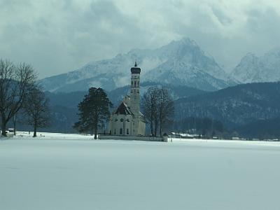 Thursday 2009-03-26  &nbsp;&nbsp;&nbsp; On our way to Neuschwanstein castle   We turn off the B17 and head towards the village of Hohenschwangau. This church stands alone in a field and is visible from both castles. It has the peculiar onion-shaped dome common to churches in this part of Germany.