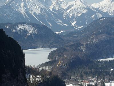 Saturday 2009-03-28&nbsp;&nbsp;&nbsp;  On the way down from Tegelberg Mountain   A glimpse of Hohenschwangau. The frozen Alpsee is behind the castle.