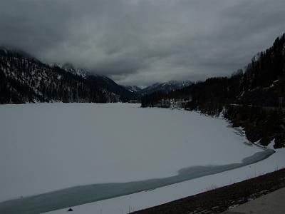 Monday 2009-03-30&nbsp;&nbsp;&nbsp;  Sylvensteinsee   Behind the dam wall is mostly frozen except for a small channel near the edge.