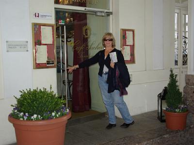 Wednesday 2009-04-01&nbsp;&nbsp;&nbsp;   Hofgaße Innsbruck Austria   In the archway is a Cafe Sacher - from the company that gave us the famous instant mix cake, the Sacher Torte.