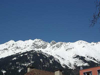 Wednesday 2009-04-01 &nbsp;&nbsp;&nbsp;  Hafelekar  Innsbruck Austria   Two hang gliders soar over the Nordkette Range.  There is a building visible near the peak.